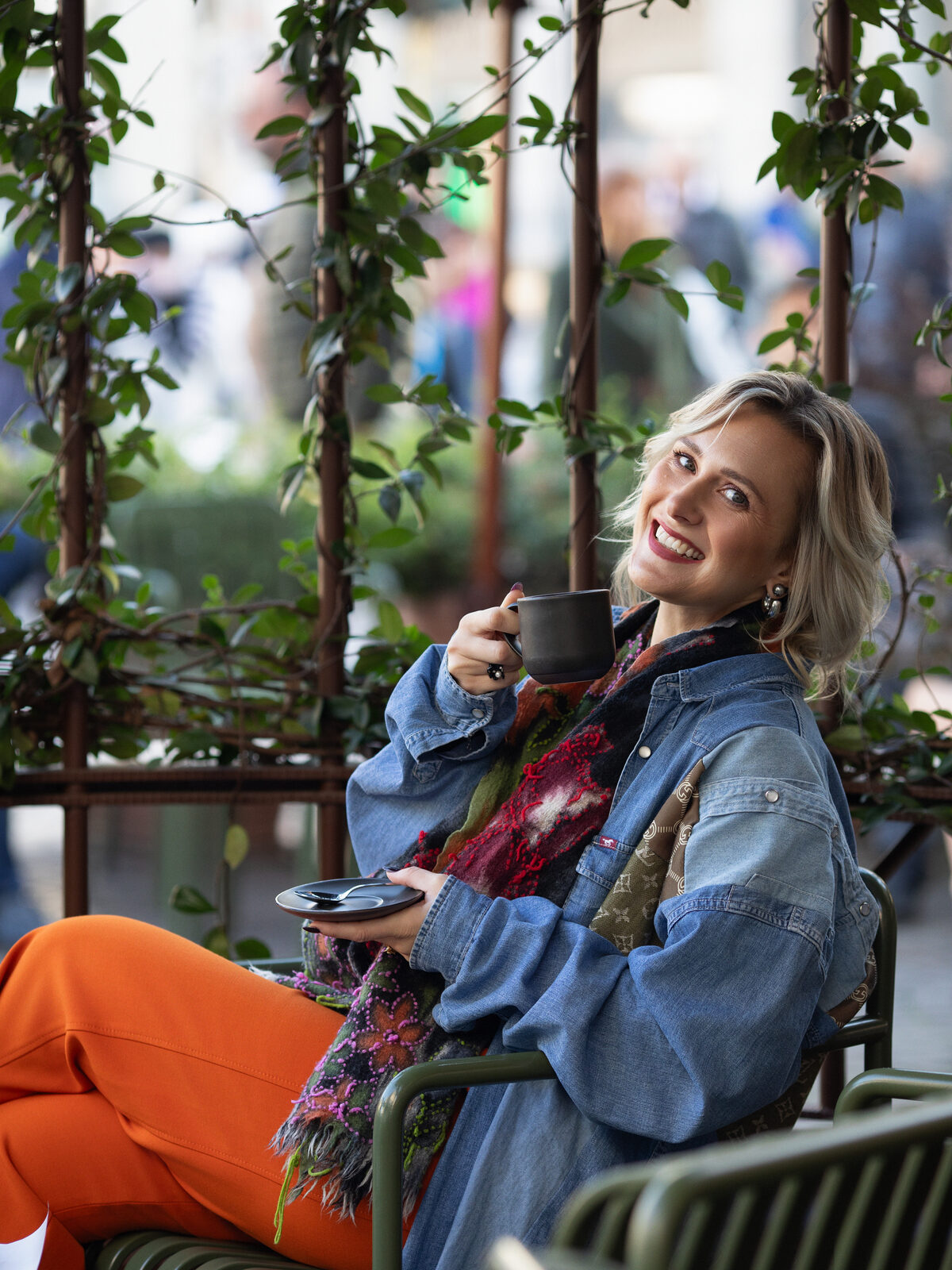 Indre Butkeviciute, founder of Lily Advisory, smiling with a coffee in Milan