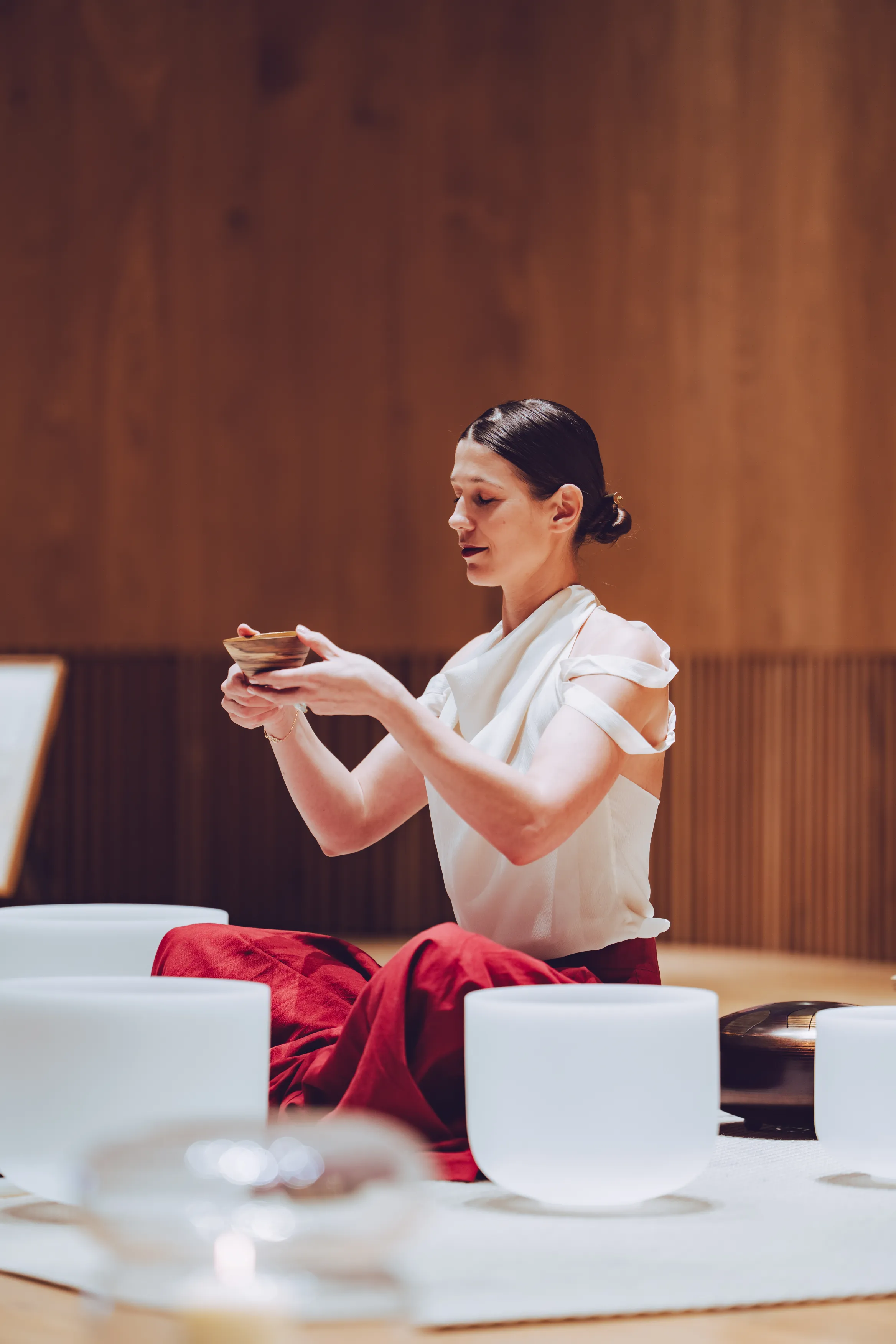 Milli Maier in ritual setting with crystal bowls