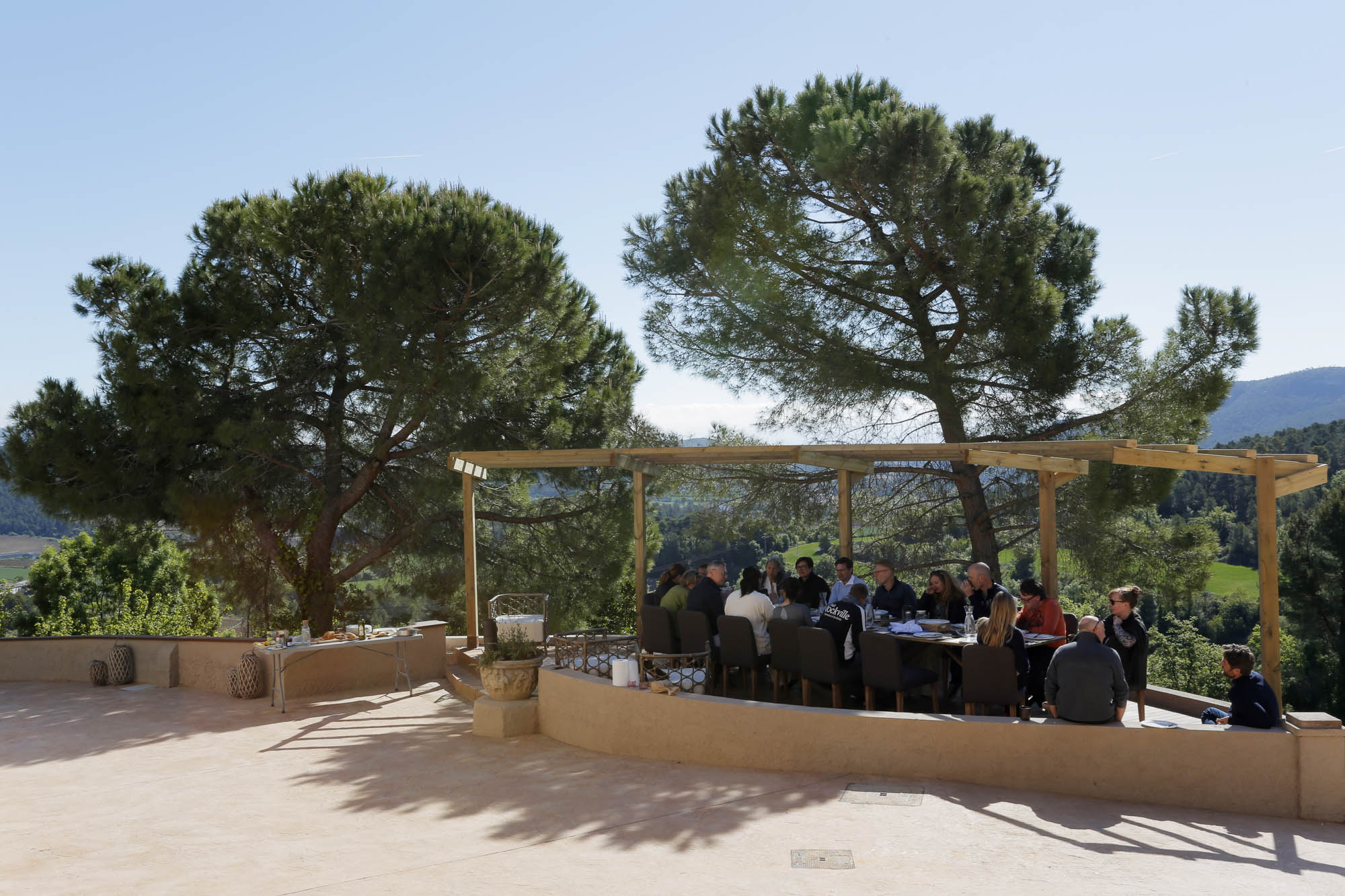 Outdoor dining terrace under pergola